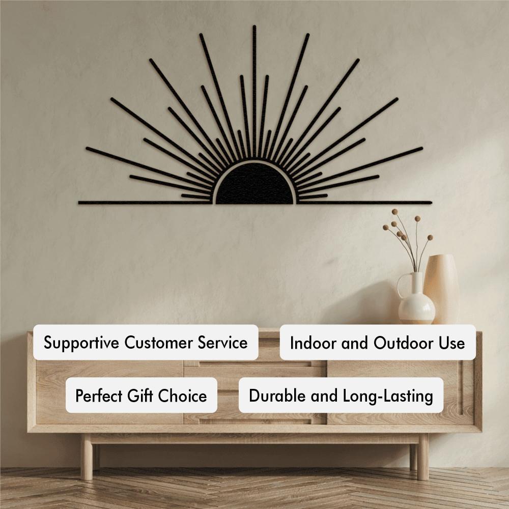 Modern minimalist sunburst metal wall art in black, displayed above a light wood console table