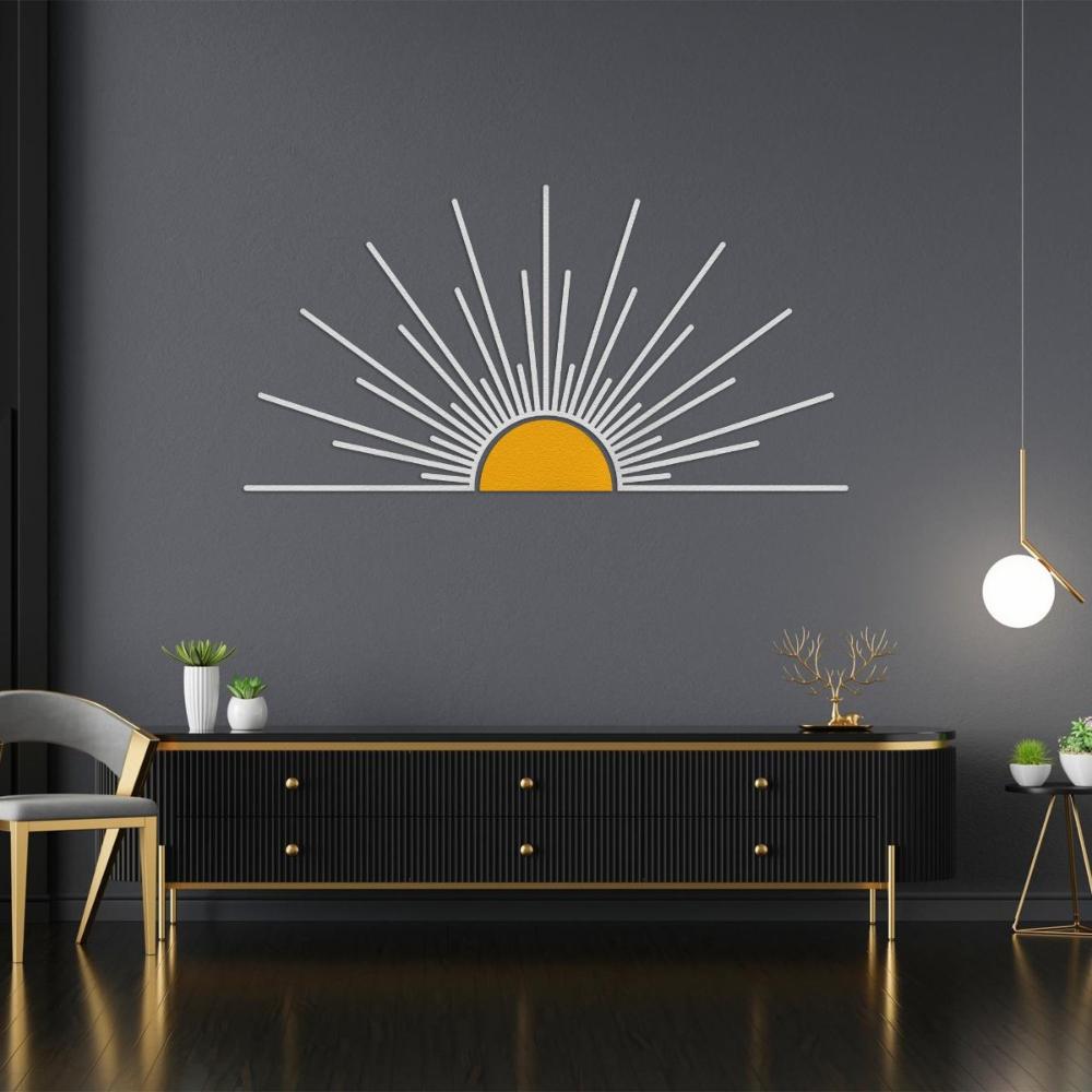 Minimalist metal sunburst wall art featuring a white sunburst design with a yellow center, displayed on a dark wall above a modern black and gold sideboard, creating a bold and stylish statement in a contemporary interior.