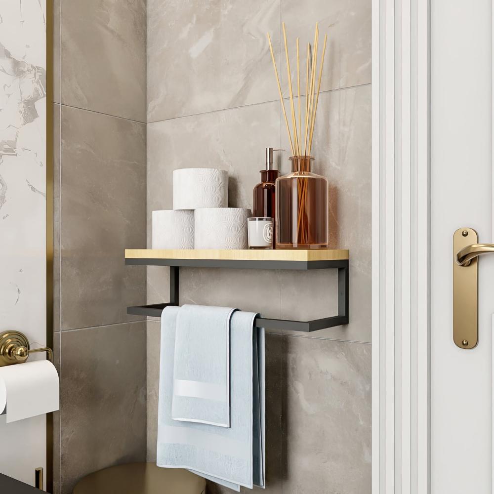 A modern wall-mounted towel holder with a black metal frame and a natural wood shelf, featuring simple, clean aesthetics. Decorative jars are placed on top, and a light blue towel hangs below.