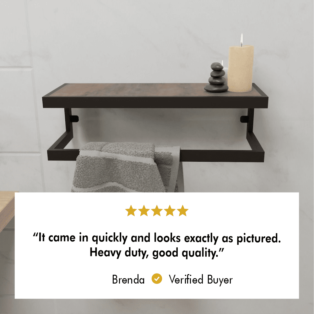 A modern towel holder with a wooden shelf and a black metal frame displayed with candles and a folded towel underneath. A 5-star review highlights customer satisfaction: "It came in quickly and looks exactly as pictured. Heavy duty, good quality."