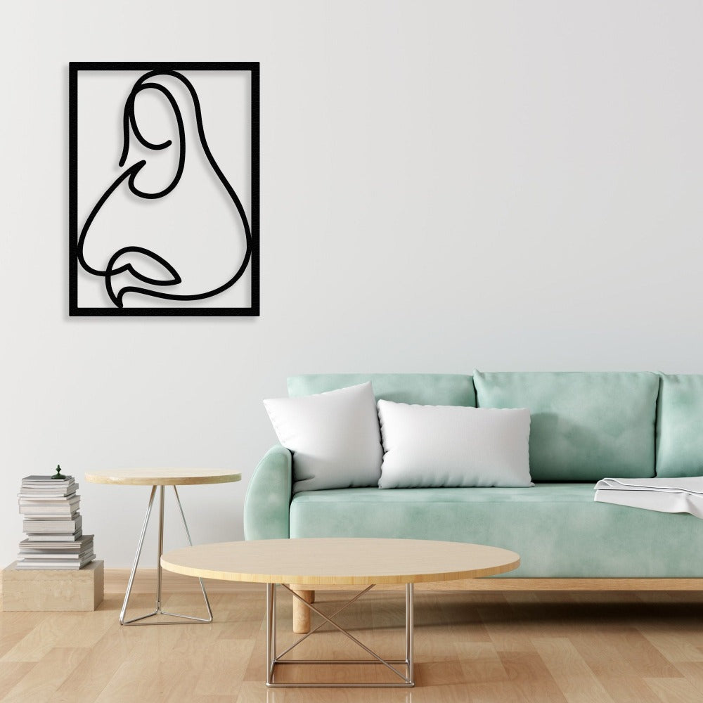 A contemporary black metal wall art of the Mona Lisa, featured in a cozy living room with a mint-green sofa and modern furniture.