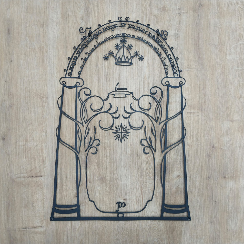 Large metal wall decor depicting the mystical elven-etched Moria Gate.