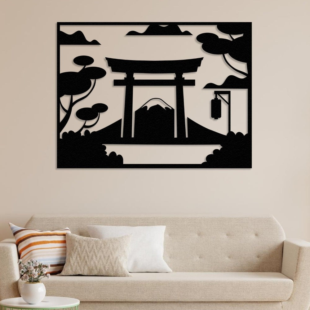 A stylish Japanese Torii gate black metal wall art with Mount Fuji, displayed on a neutral-toned wall behind a beige sofa, enhancing the minimalist aesthetic of the space.