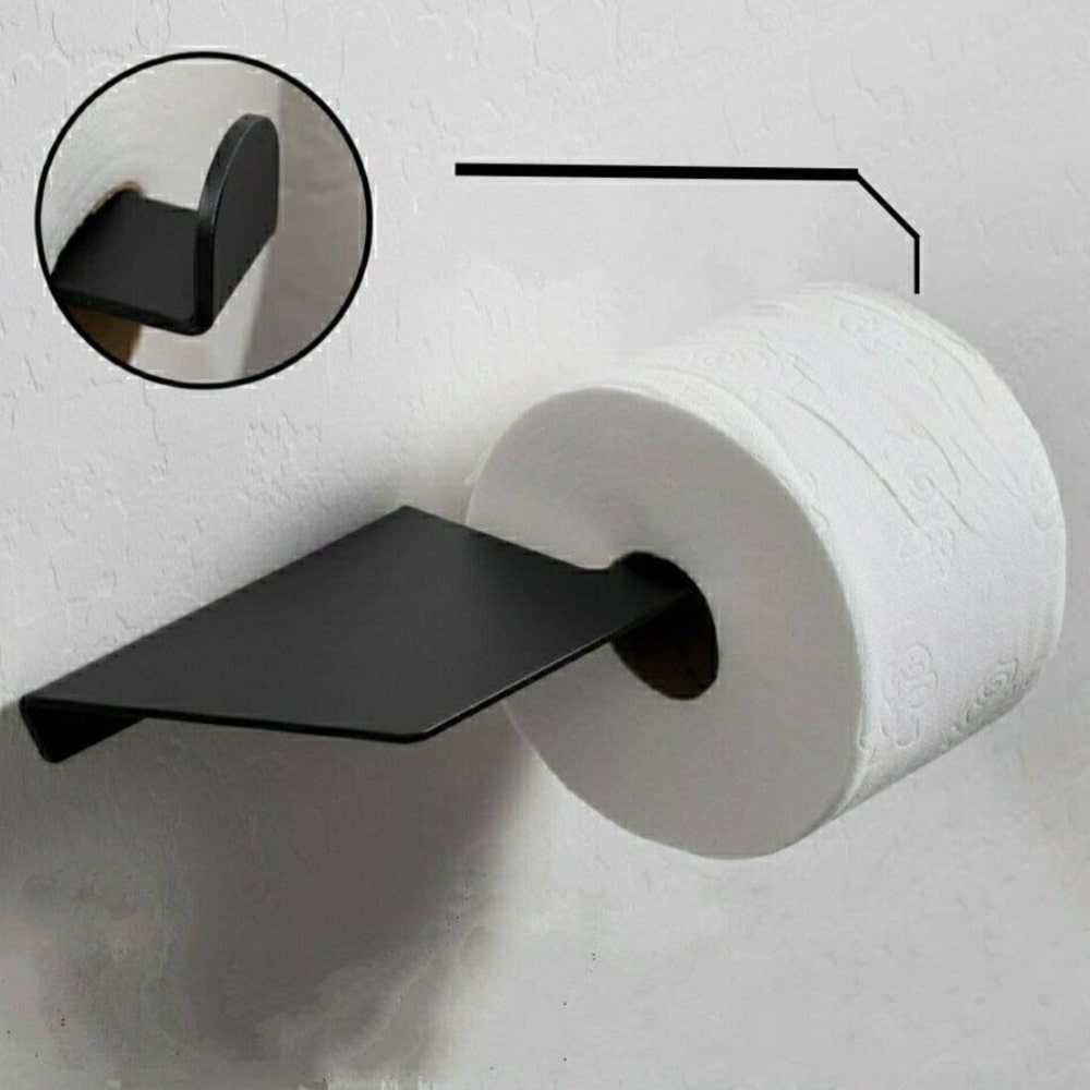 A close-up of a black multifunctional toilet paper holder and shelf mounted on a white wall, showcasing a sleek, modern design