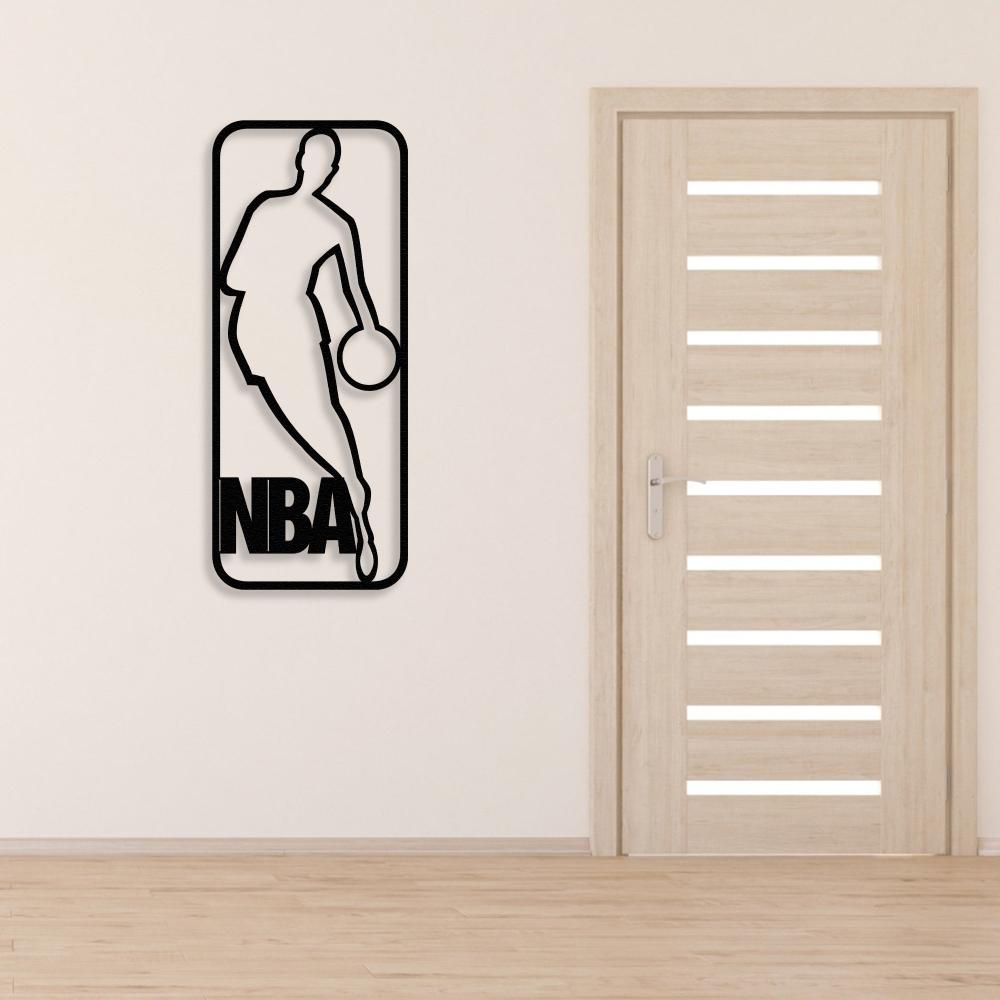 A sleek black metal wall art featuring an NBA-inspired basketball player silhouette, mounted beside a modern wooden door in a minimalist room setting.