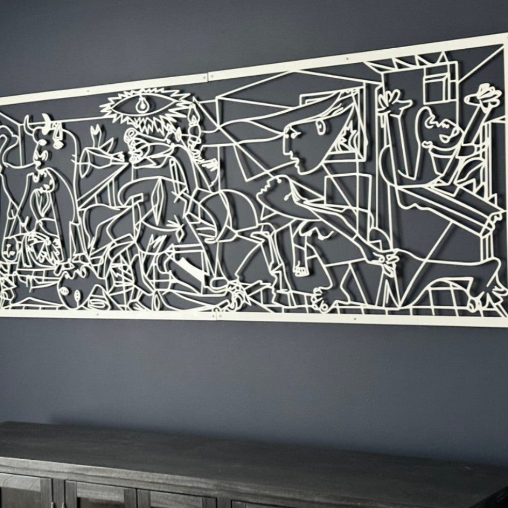 White metal wall art inspired by Pablo Picasso's Guernica, mounted on a dark gray wall above a dark wood console, offering a striking contrast between the art and the background