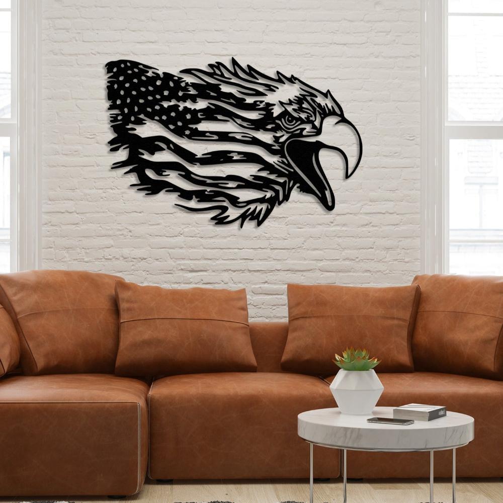 Striking black metal wall art showcasing a proud American bald eagle with outstretched wings, perched atop a weathered American flag. 