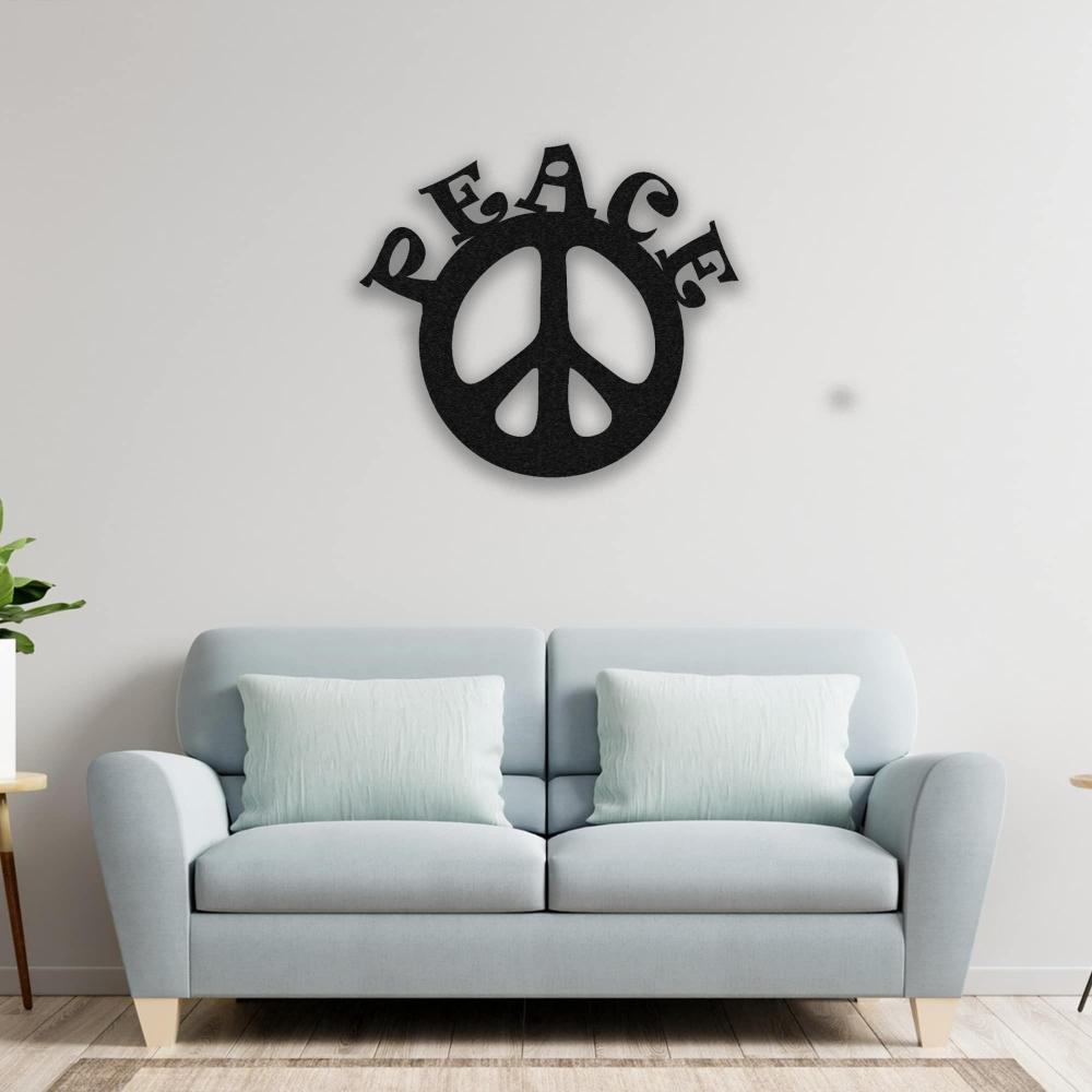 A modern living room with a light blue sofa adorned with matching pillows, highlighted by a black "Peace" metal wall art hanging on the white wall. A fresh plant adds natural charm.