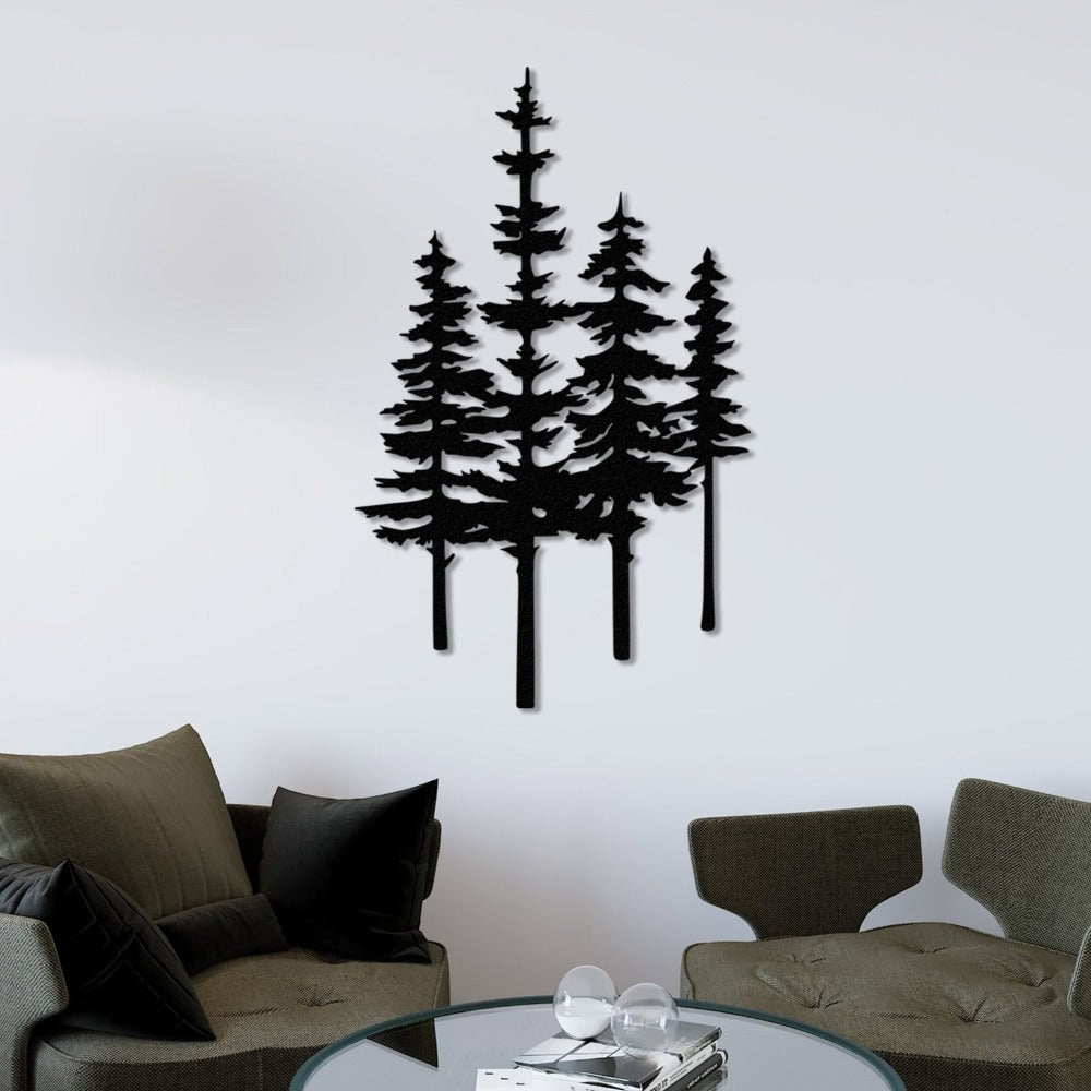 Black metal pine tree wall art mounted on a white wall above a modern living room setup with olive green chairs and a glass coffee table.