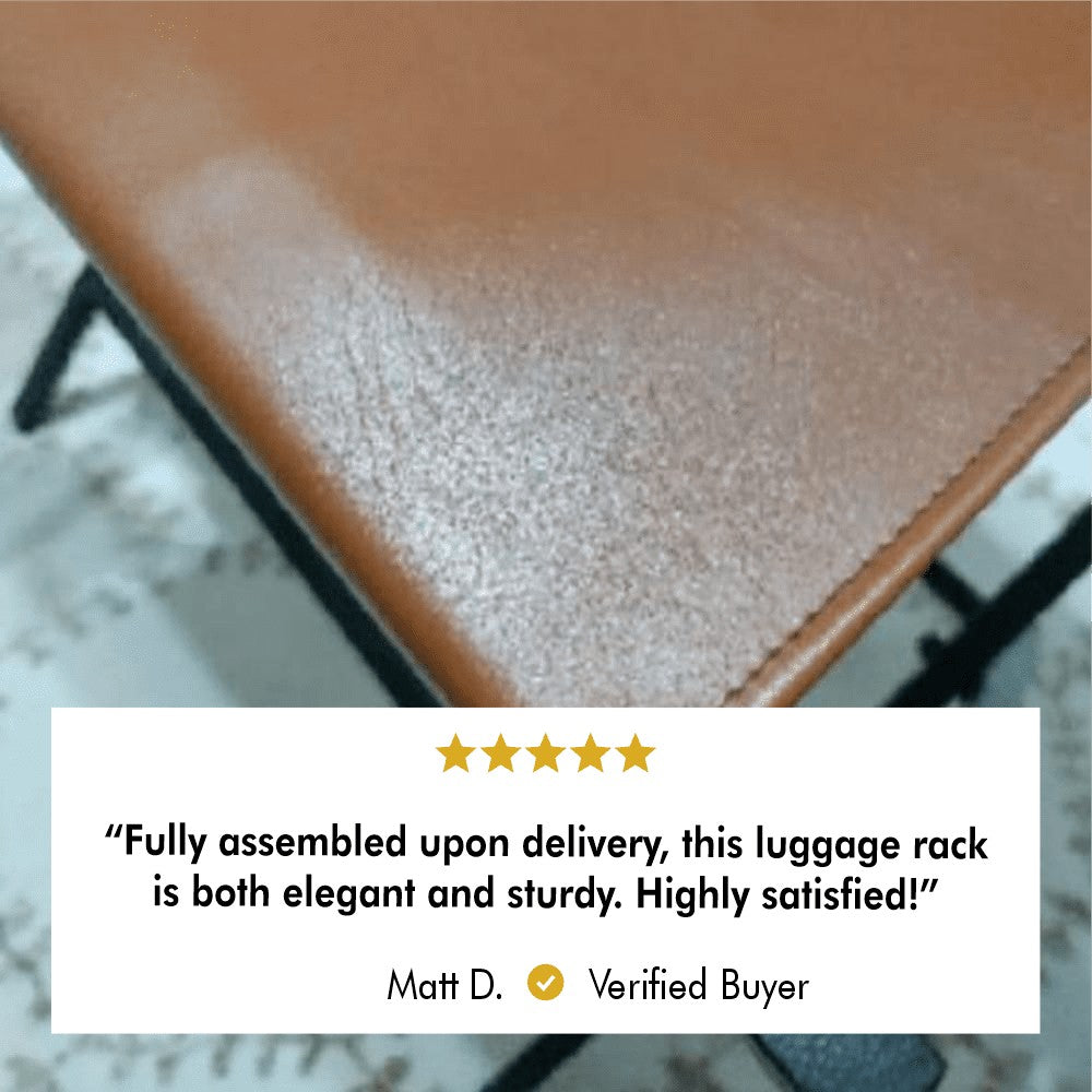 Close-up of the leather detail on the foldable metal suitcase rack, emphasizing its premium quality and craftsmanship, along with a review from a satisfied customer