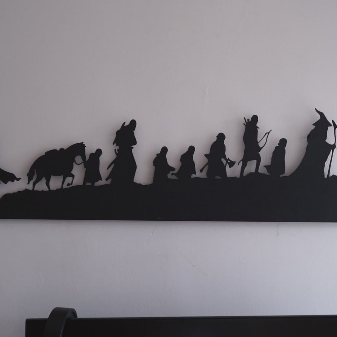 The Lord of the Rings silhouette metal wall art featuring a group of characters walking in a line