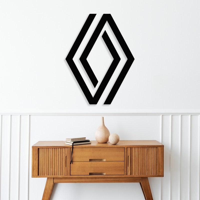 A sleek black metal wall art design featuring a geometric pattern inspired by a car logo, mounted above a modern wooden console table in a stylish, minimalist interior.