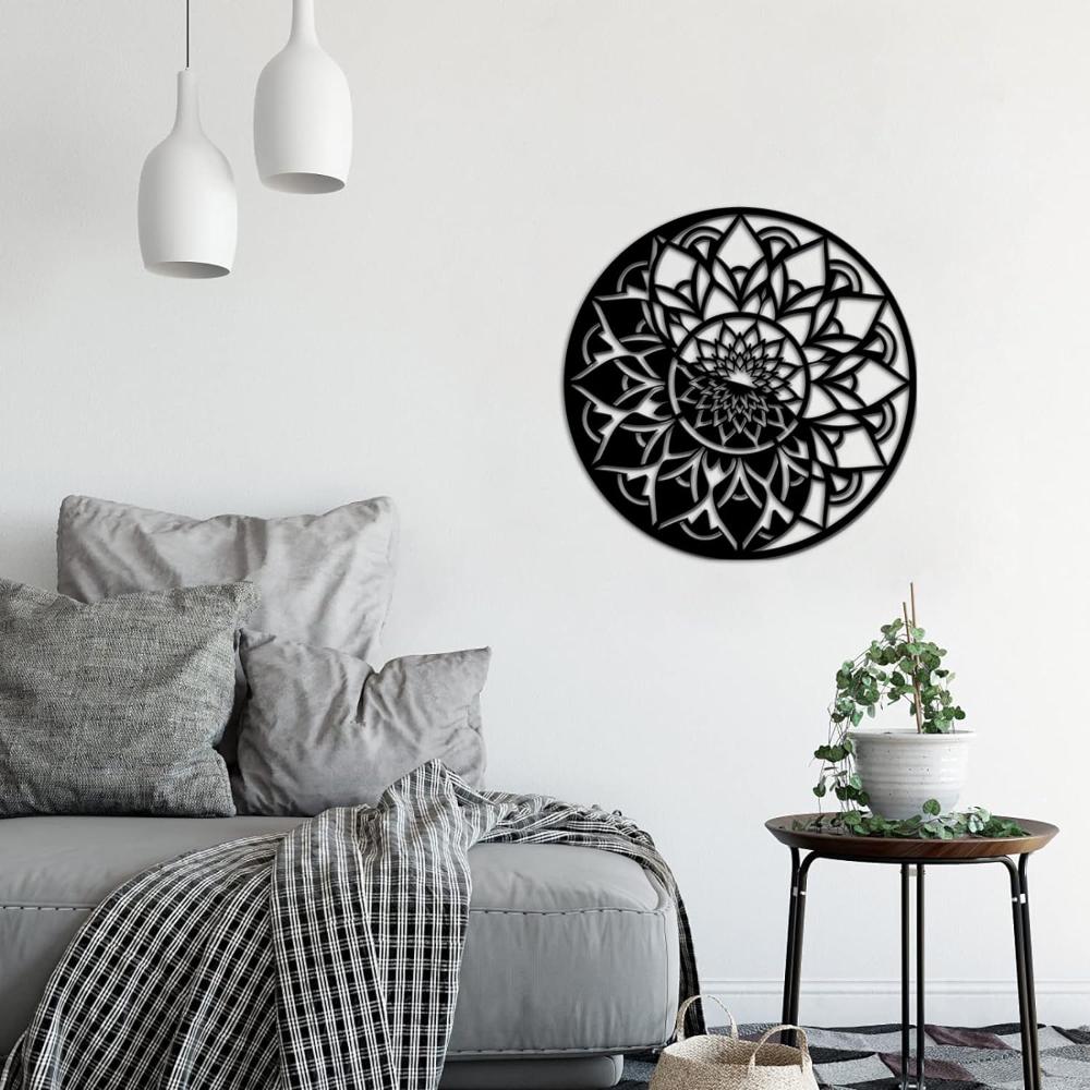 A cozy bedroom setting featuring a round mandala floral metal wall art mounted on the wall, paired with a comfortable bed, pillows, and a small side table with greenery.