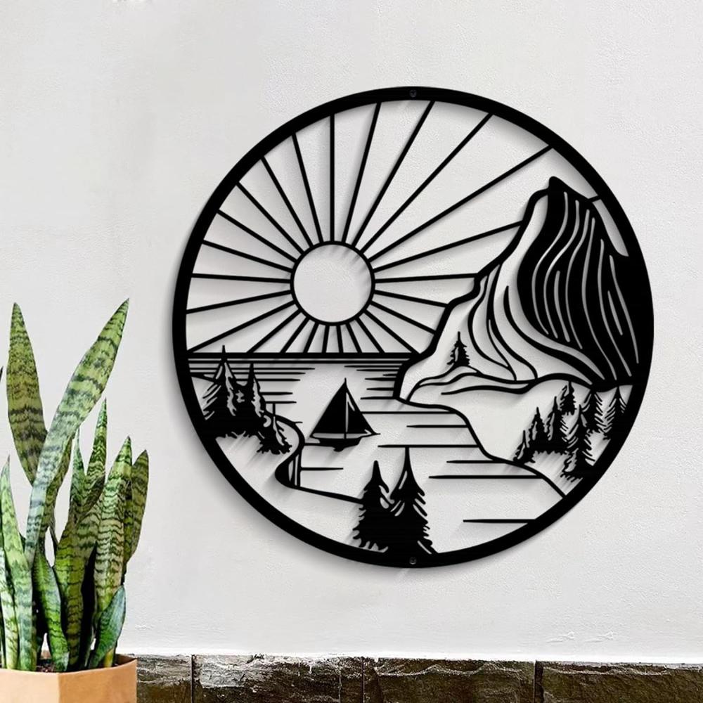 Round metal wall art featuring a serene landscape with a setting sun, mountains, trees, and a sailboat, adding nature-inspired elegance to any wall.