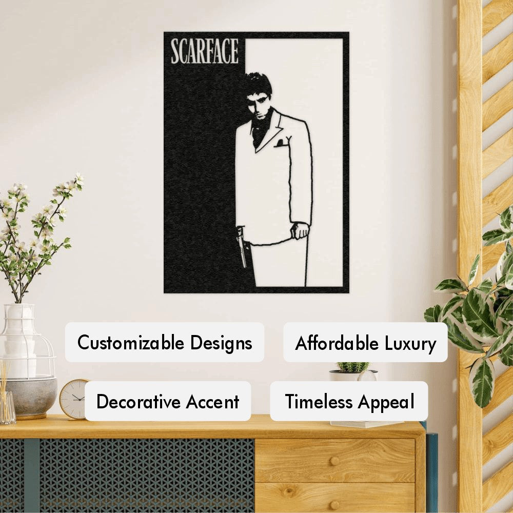 A black-and-white metal wall art piece featuring the iconic image of Scarface. The artwork shows the character in a suit holding a gun, split into contrasting black and white halves. Below the image are text highlights such as "Customizable Designs," "Affordable Luxury," "Decorative Accent," and "Timeless Appeal."