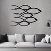  Modern "School of Fish" metal wall art in a sleek black finish, displayed on a minimalist gray wall above a white sofa with gray cushions.