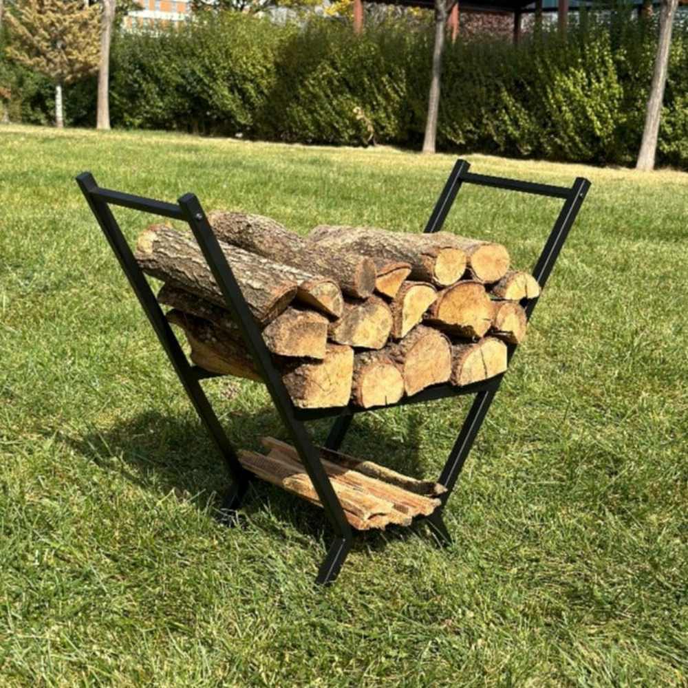 Side view of a black V-shaped firewood holder outdoors, filled with logs in both the upper and lower compartments, highlighting its ergonomic design.