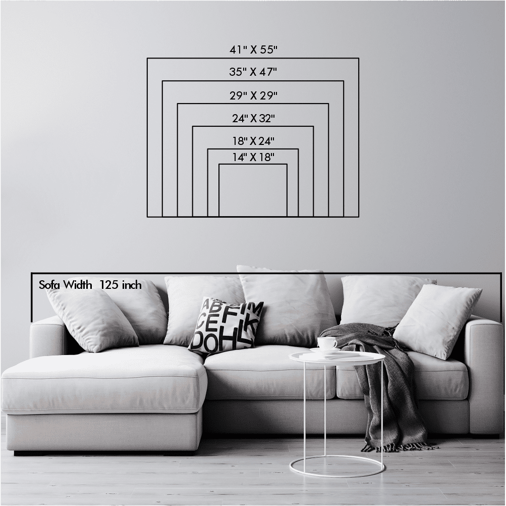 Size chart for metal wall art displayed above a sofa. Dimensions range from 14" x 18" to 41" x 55". Sofa width is labeled as 125 inches for scale.