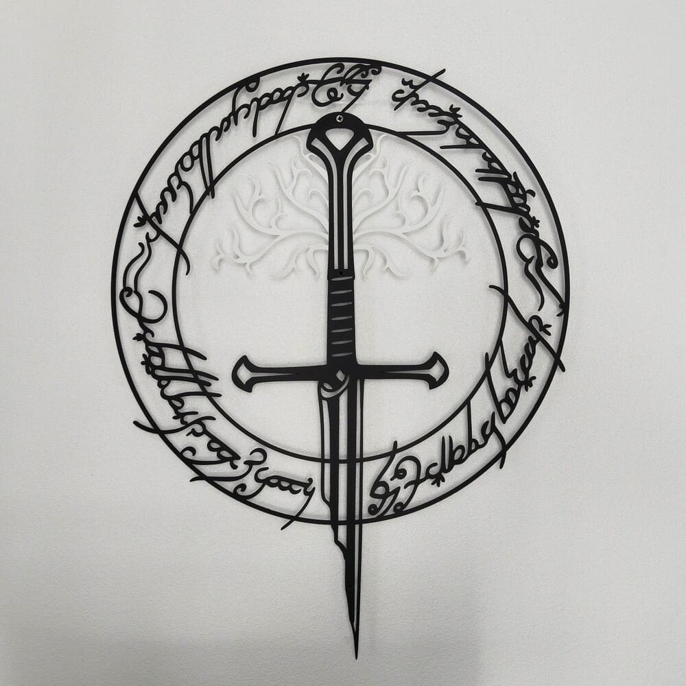 A front view of a black metal wall art featuring a sword surrounded by detailed circular inscriptions, mounted on a white wall.