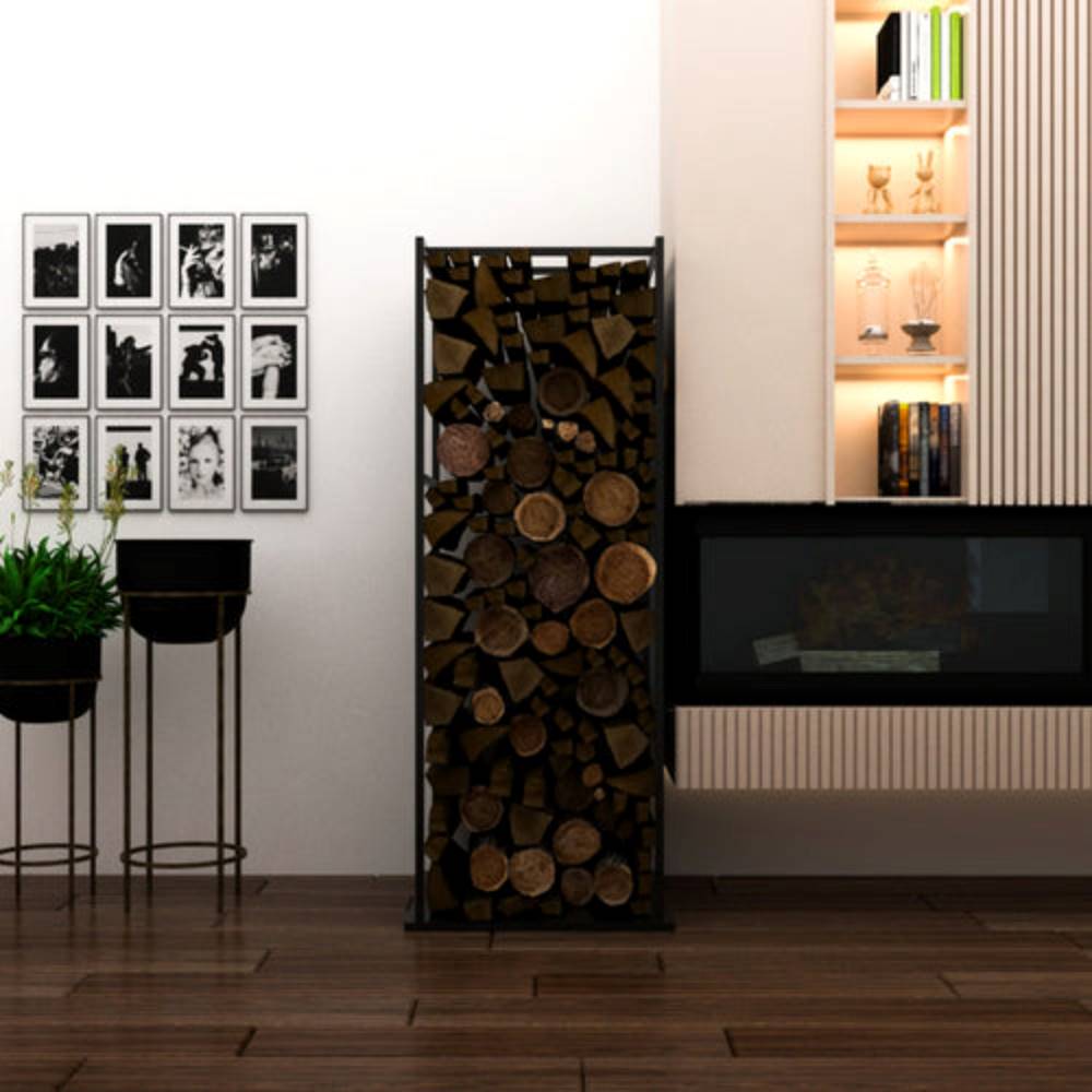 A tall black metal firewood rack filled with neatly stacked logs, placed in a modern living room. The room features a gallery wall with black-and-white photos, decorative plants, wooden flooring, and a contemporary fireplace with illuminated shelves.