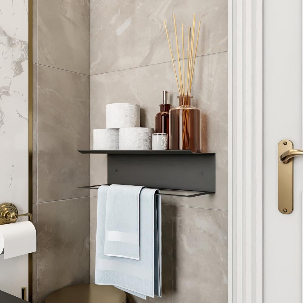 Black towel holder and shelf styled with toiletries and towels in a modern bathroom setting, demonstrating a combination of utility and aesthetics