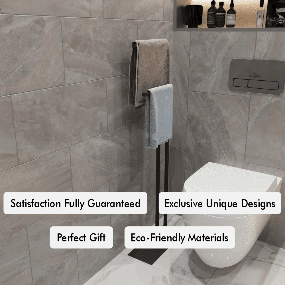  A towel holder in a contemporary bathroom with gray tiled walls, displaying two towels with promotional tags such as "satisfaction fully guaranteed" and "eco-friendly materials".