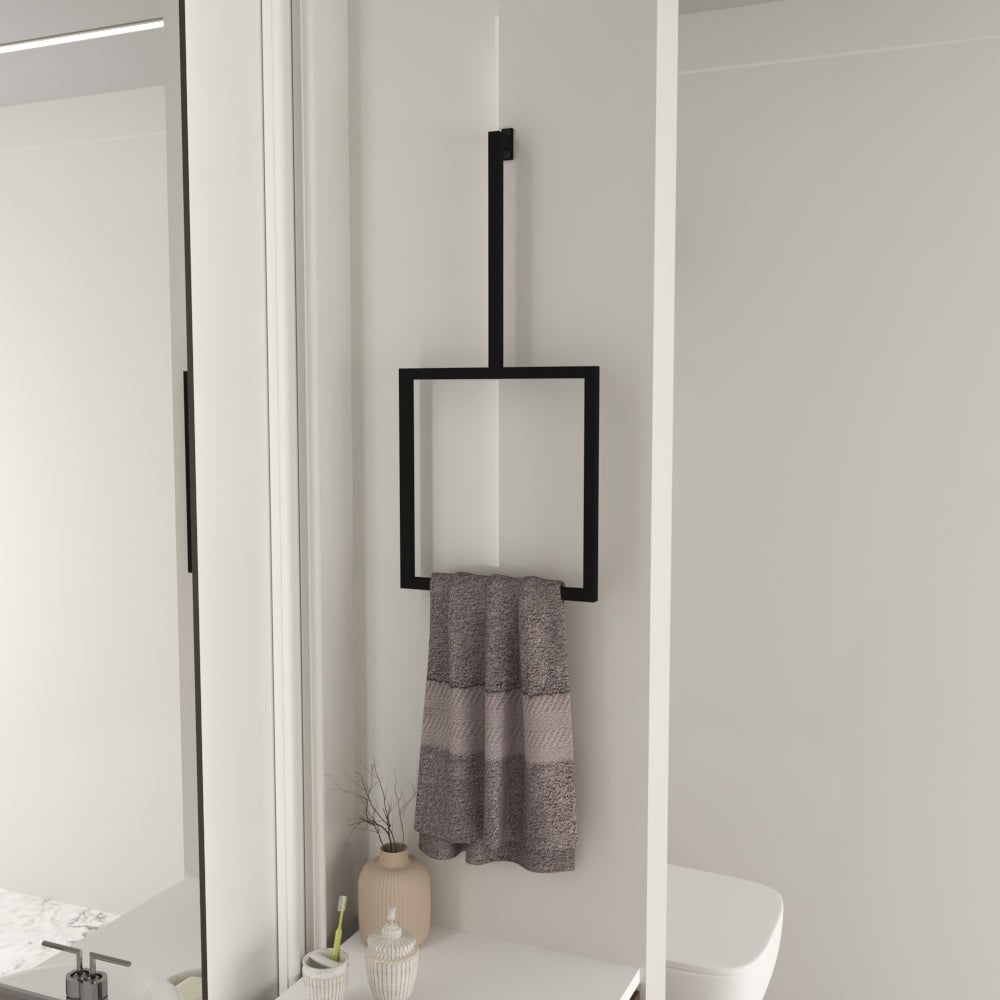 Wall-mounted black vertical towel rack holding a striped gray towel, displayed in a modern bathroom with light-colored walls and simple, clean decor.