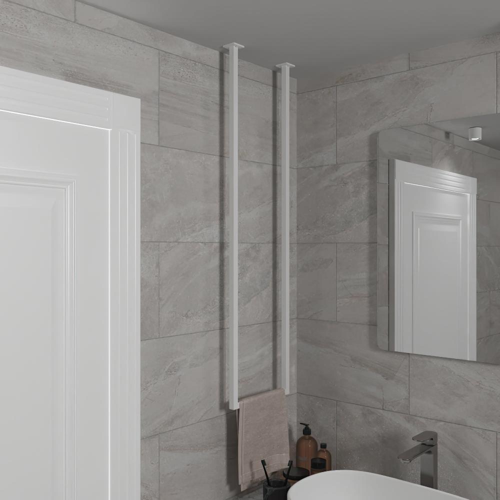 Minimalist white vertical towel holder mounted from the ceiling on a light gray tiled bathroom wall near a white door and a mirror. The sleek design adds a modern touch to any bathroom decor.