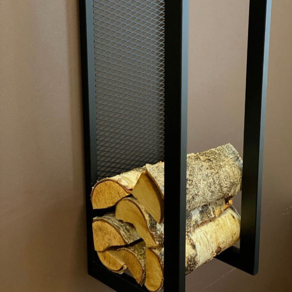 Close-up of a modern wall-mounted firewood holder featuring a black metal frame and mesh back, neatly holding a stack of firewood.