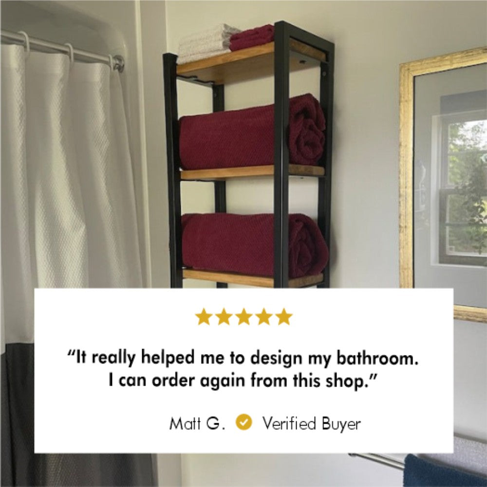 Wall-mounted metal and wood towel shelf in a bathroom setting, holding neatly folded red towels. A customer review from Matt G. reads: "It really helped me to design my bathroom. I can order again from this shop." The review is rated with 5 stars and marked as verified.