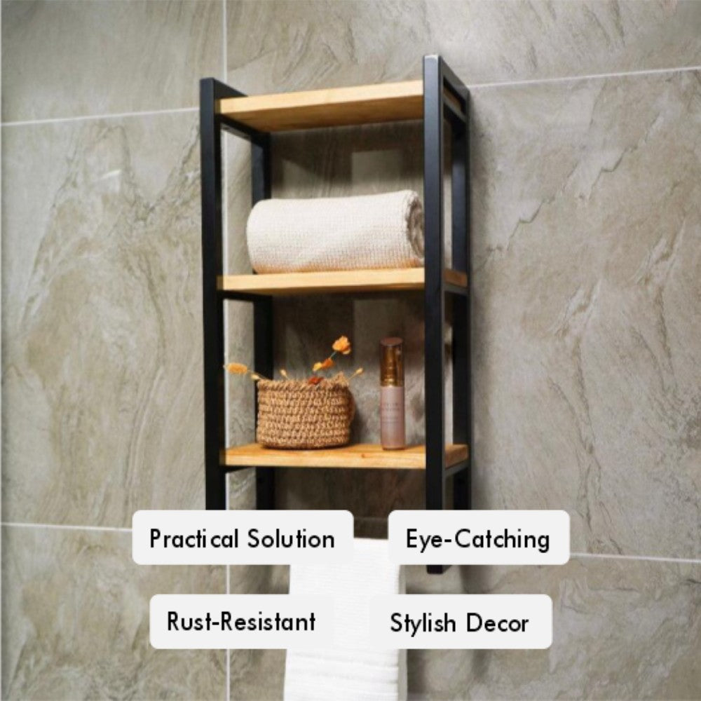 Wall-mounted bathroom storage rack featuring three wooden shelves with a black metal frame, offering practical and stylish towel storage. It includes labeled features: "Practical Solution," "Rust-Resistant," "Eye-Catching," and "Stylish Decor." Placed against a gray stone wall, it holds a rolled towel and small decorative items.