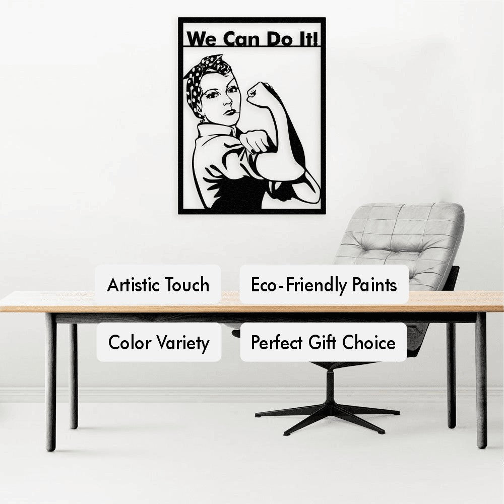 Black metal wall art of Rosie the Riveter with the "We Can Do It!" slogan displayed on a minimalist white wall in an office setting, featuring a modern desk, a grey ergonomic chair, and text highlights about eco-friendly paints, artistic touch, color variety, and gift suitability.