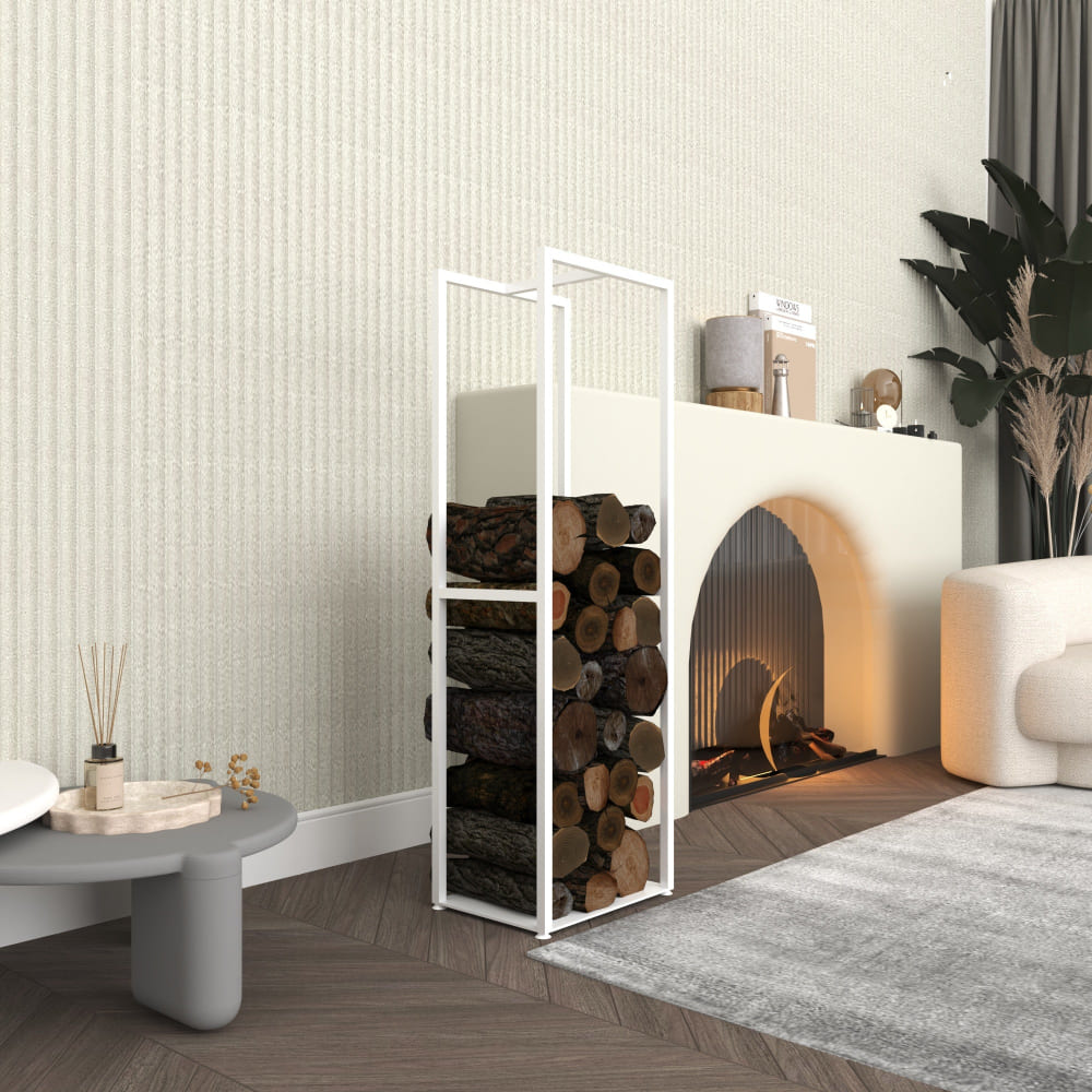 A tall white metal firewood rack filled with neatly arranged logs, set next to a modern arched fireplace in a stylish living room. The space features soft tones, a gray table with decor, and contemporary furniture for a cozy aesthetic.