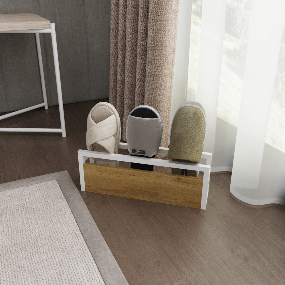 A white-framed minimalist slipper rack with a wooden front panel, holding three pairs of slippers in a modern interior