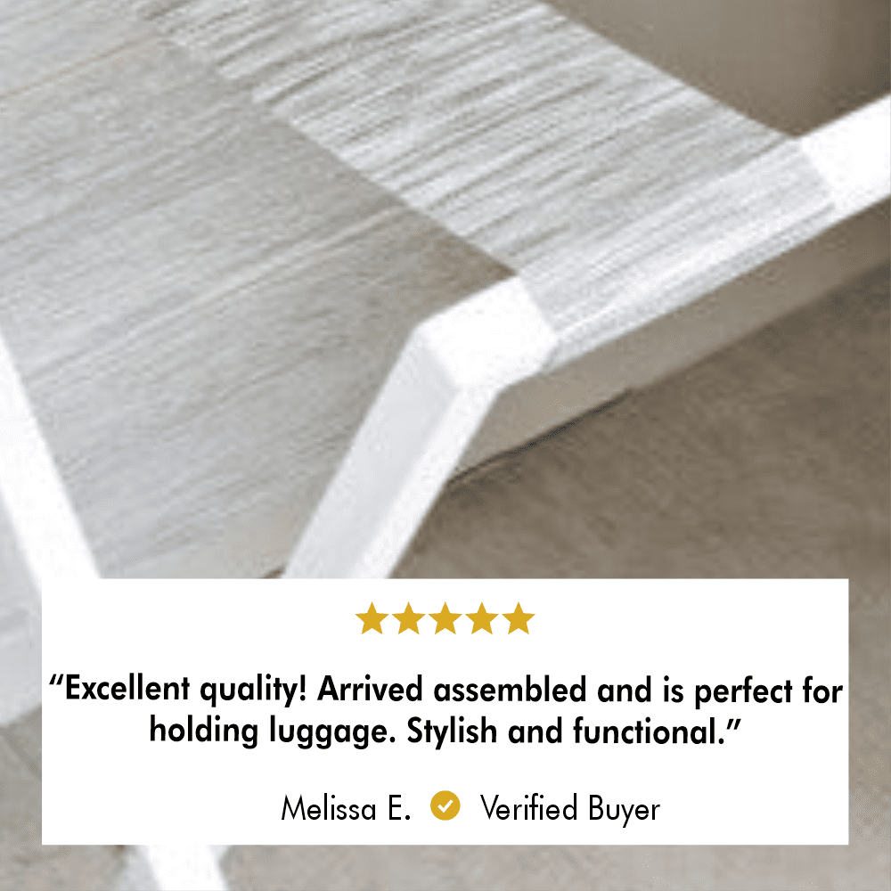 Close-up of a white luggage rack's gray strap with a customer review stating excellent quality and perfect for luggage