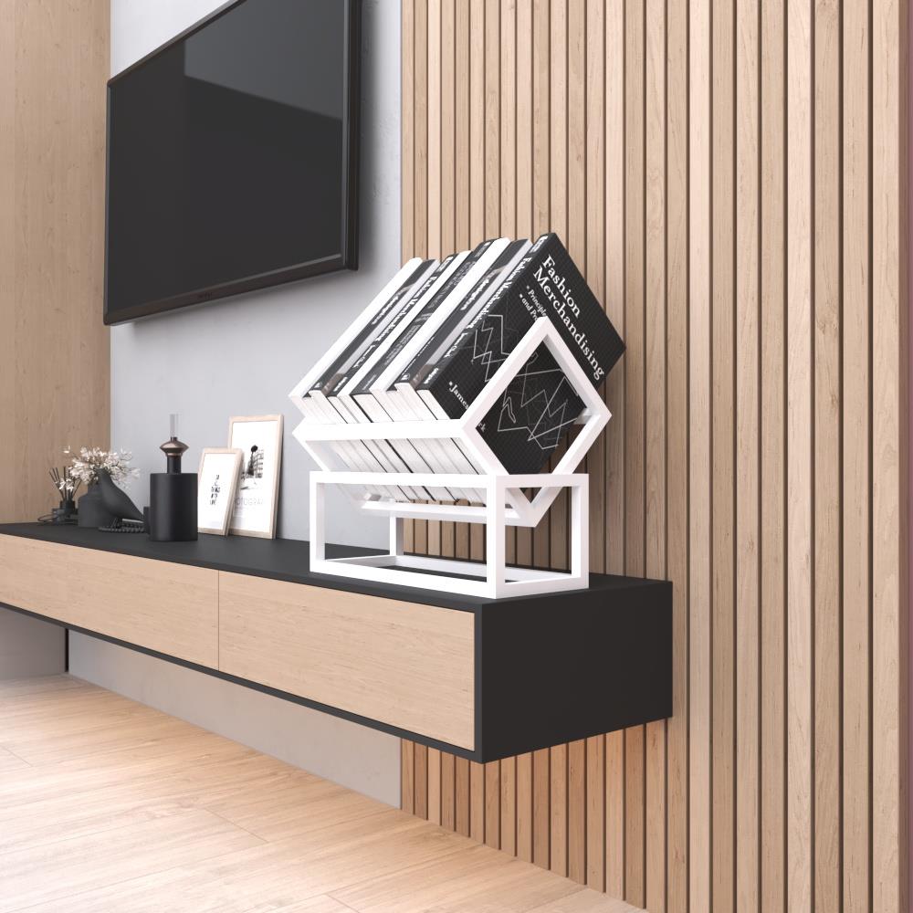 A white metal book organizer placed on a modern black console table, holding books with a minimalist decor background