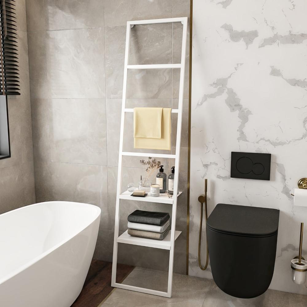 A white ladder-style towel rack with two shelves, complementing a light and airy bathroom interior, used to organize towels and toiletries.